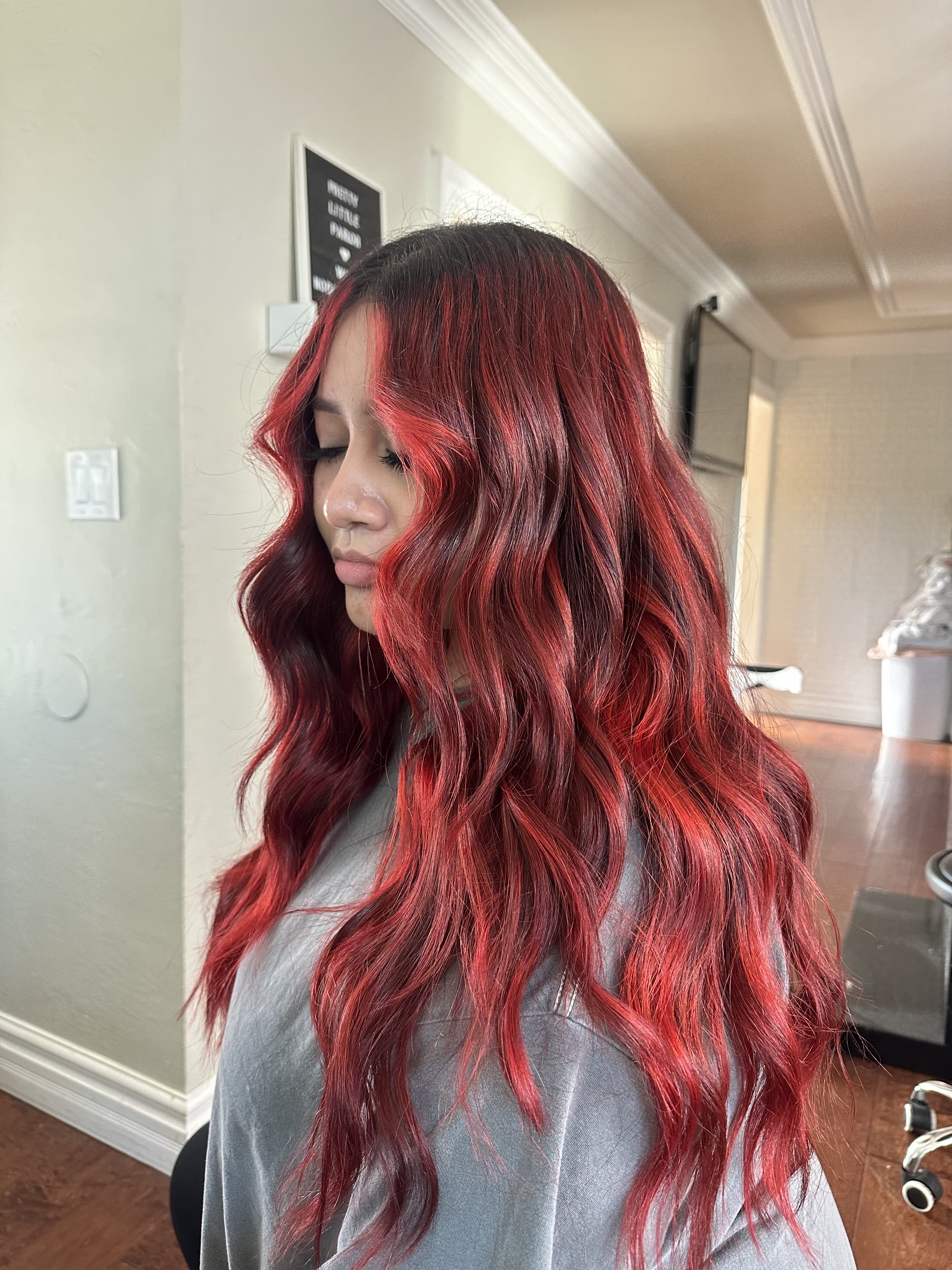 Client vivid red balayage with dark roots